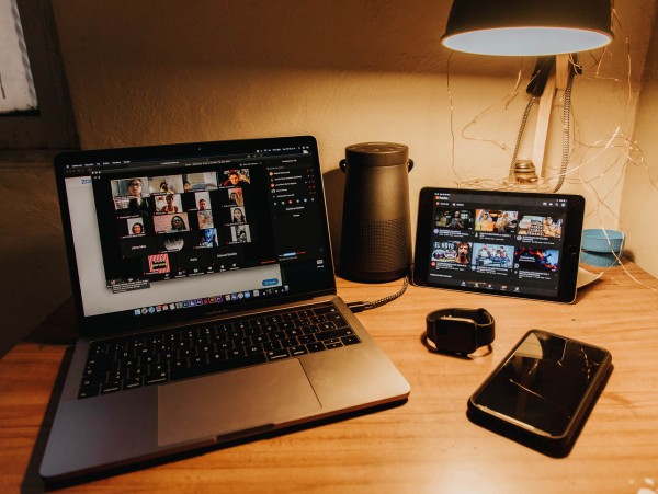 Black and silver laptop computer on a brown wooden table